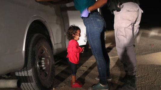 Photographer details the emotional moment that created viral border photo of crying toddler