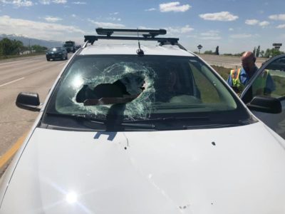 Woman unharmed after metal beam smashes through windshield