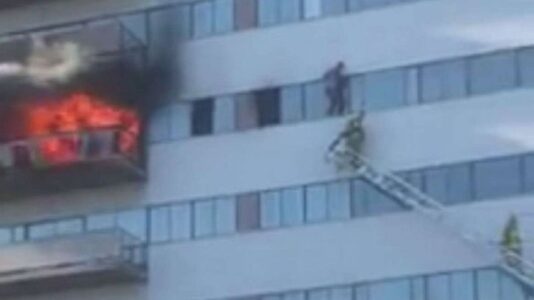 Daring escape saves man from high-rise fire that injured 11