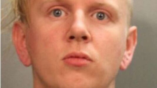 Man arrested after allegedly driving van into GOP registration tent