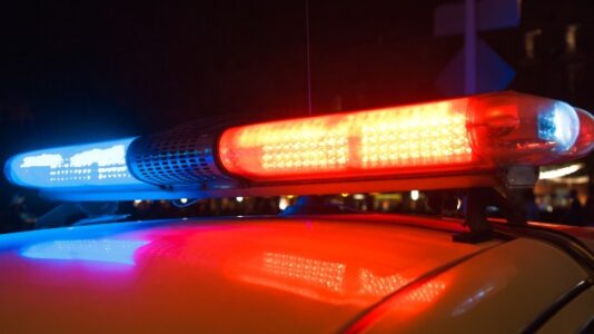 Woman found dead after shootout that wounded officer