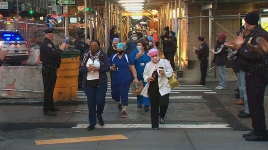 NYPD ‘backs the scrubs’ and gives send-off to visiting health workers