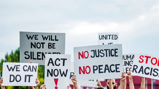 White St. Louis couple point guns on protesters marching by their mansion to mayor’s home