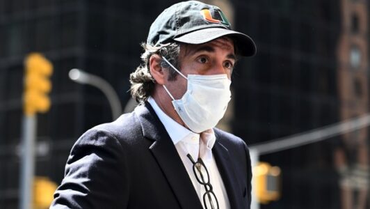 Michael Cohen was sent back to prison over tell-all book on Trump, suit claims