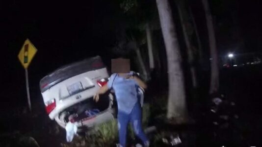Video shows hero cop single-handedly lift overturned car off woman to save her life