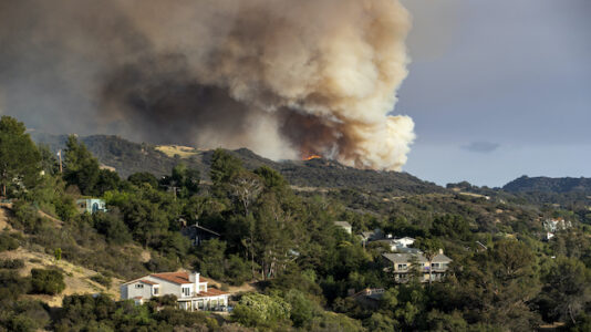 Suspected arsonist sought in LA County wildland fire threatening homes
