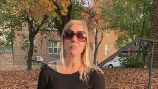 Visually impaired runner completes marathon with the help of guides, friends