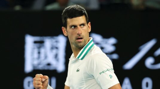 Djokovic in limbo amid Australian political tussle over COVID vaccination status