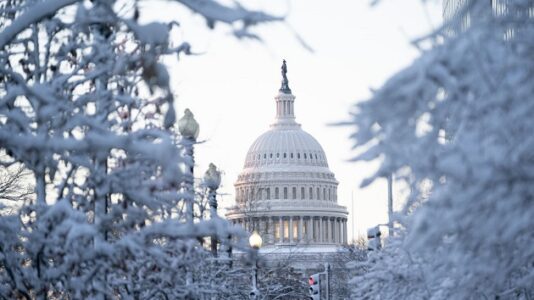 Cold blast, cross-country storm hit both coasts