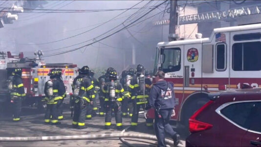 Six killed, including firefighter and three kids, in residential fires in two cities