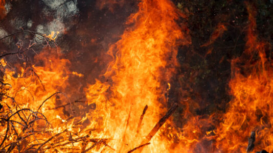 More than a dozen uncontained wildfires continue to burn in the West