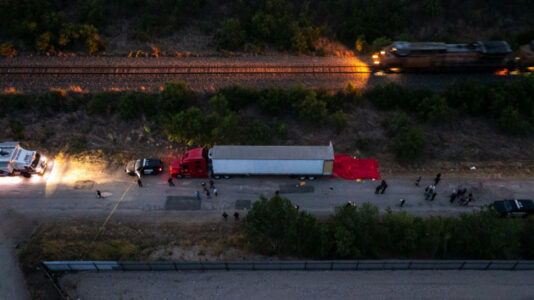 Four charged after 53 found dead in Texas tractor-trailer