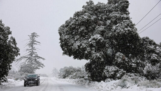 Rare snowfall in Southern California strands residents as another winter storm takes aim