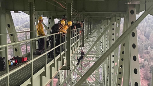 Man rescued dangling from California’s highest bridge 700 feet above river