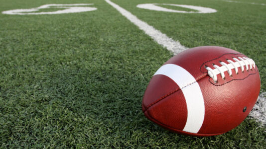 In fire-ravaged Maui, a football team pushes on, traveling more than an hour to practice
