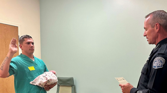 Police officer gets sworn in with newborn son at hospital