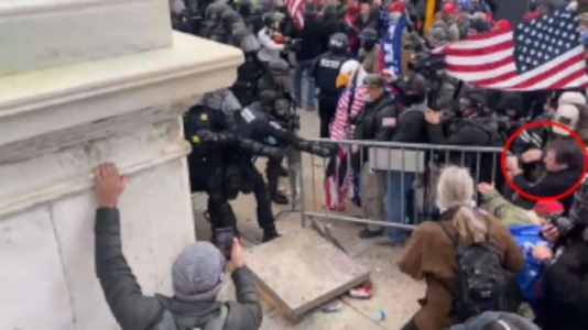 Man who used Trump flag to assault officers on Jan. 6 arrested, DOJ says