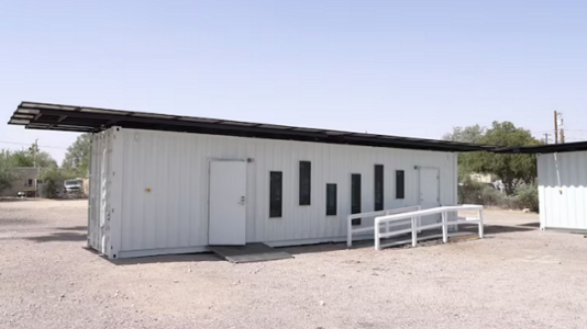 Shipping containers repurposed as cooling stations by Tucson housing assistance group