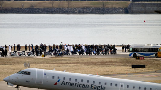 Grieving family members visit site of DC plane crash