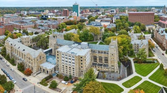 Lawsuit filed against former Michigan coach in alleged hacking case