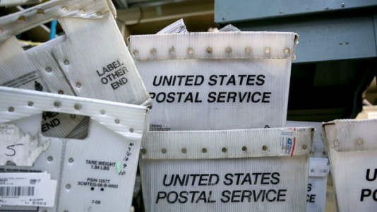 1 employee dead in shooting at USPS center, suspect at large: Police