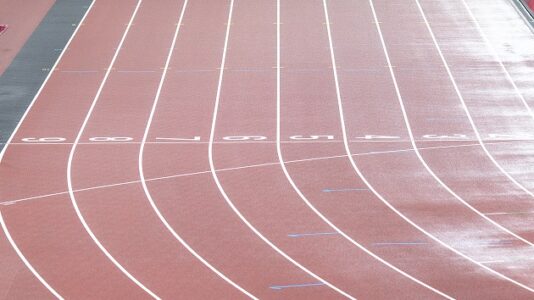 Family threatens legal action after track star is disqualified over celebration paying homage to Olympian