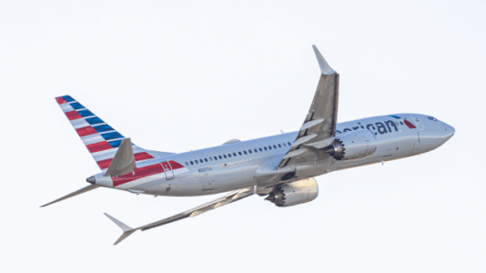 Passengers exit plane via emergency slide after aborted takeoff