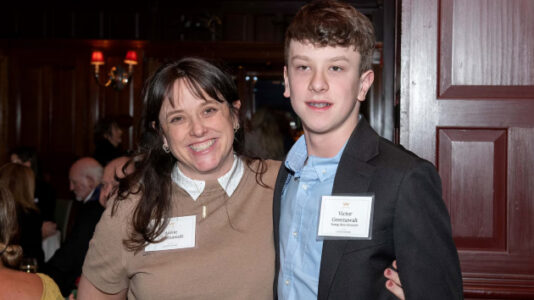 Boy receiving Citizen Honor Award for shielding classmate during school shooting in Minneapolis